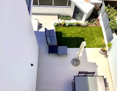 an overhead view of a patio with chairs and a lawn at ATHENS RIVIERA Grand Panoramic VILLAS I & II LAGONISSI in Kalívia Thorikoú