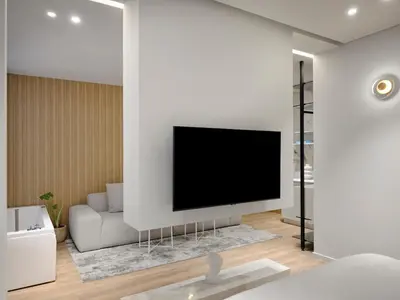 a living room with a flat screen tv on a wall at Nur Aparthotel Athens in Athens