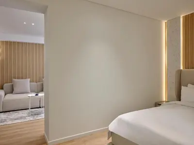 a hotel room with a bed and a couch at Nur Aparthotel Athens in Athens