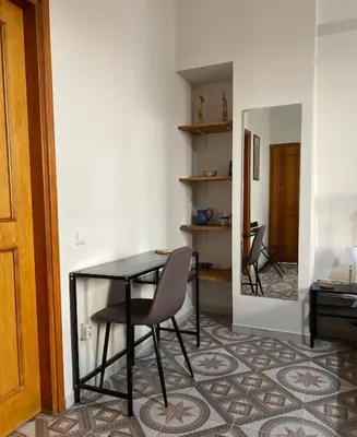 a dining room with a table and chairs in a room at Apartment in Athens near Acropolis in Athens