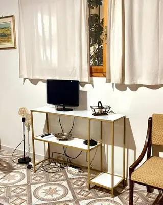 a desk with a computer on it in a room at Apartment in Athens near Acropolis in Athens