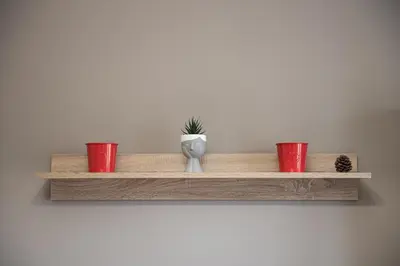 a shelf with three cups and a vase on it at Spacious renovated flat 10min to metro station (KOL_71) in Athens