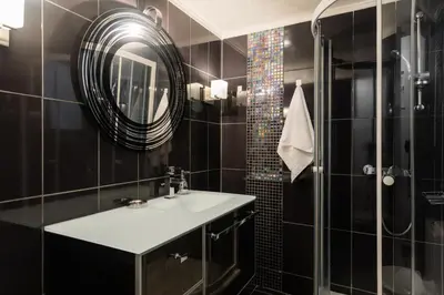 a bathroom with a sink and a shower with a mirror at Beautiful City Rooms close to Acropolis in Athens