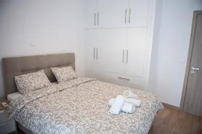 a bedroom with a bed with towels on it at Bright apartment 8min to metro station (KOL_25) in Athens