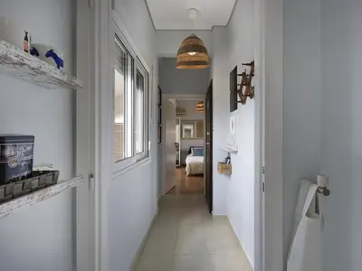 a hallway with a hallway leading to a bedroom at Cozy Loft with private terrace in the heart of Koukaki, Athens in Athens
