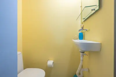 a bathroom with a sink and a toilet at Andromar in the heart of Kolonaki in Athens