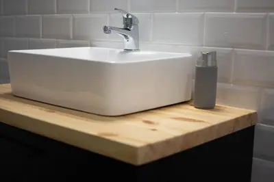 a white sink sitting on top of a wooden counter at Garden of Eden in Koukaki in Athens