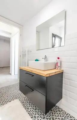 a bathroom with a sink and a mirror at Garden of Eden in Koukaki in Athens