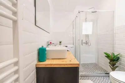 a bathroom with a sink and a shower at Garden of Eden in Koukaki in Athens