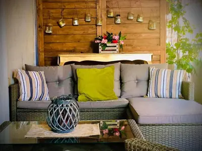 a living room with a couch and a table at Modern 2BR city flat 10min from the beach in Athens
