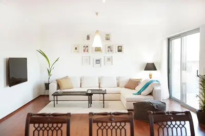 a living room with a couch and a table at Luxury Apartment with Exceptional View in Athens