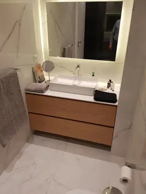 a bathroom with a sink and a mirror at Stylish Central Apartment in Kolonaki (walking distance to Syntagma) in Athens