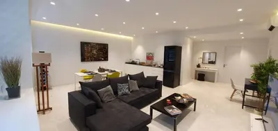 a living room with a couch and a table at Stylish Central Apartment in Kolonaki (walking distance to Syntagma) in Athens