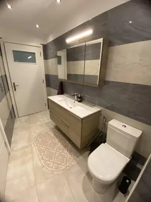 a bathroom with a white toilet and a sink at Λabirinthia in Athens