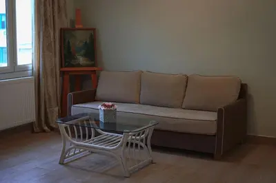 a living room with a couch and a table at Λabirinthia in Athens