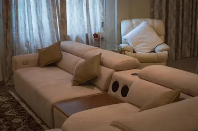 a living room with a couch and a chair at Λabirinthia in Athens