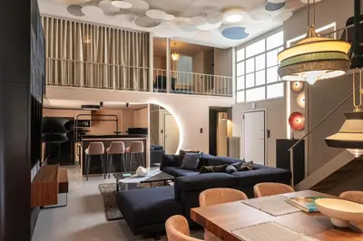 a living room with a couch and a table at The Gate by Zoia Living in Athens