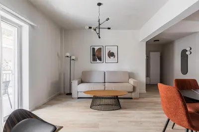 a living room with a couch and a table at Kookaki by Zoia Living in Athens