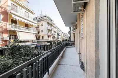 an empty street in a city with buildings at Hi end Pagrati /2bdr apartment ! in Athens