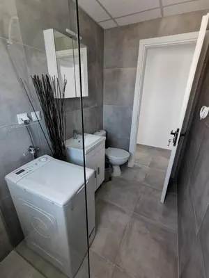 a bathroom with a toilet and a sink at Ikarus in Athens