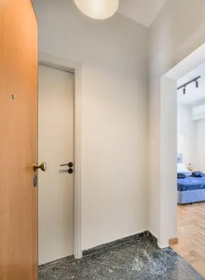 a room with a door leading to a bedroom at lecabetus penthouse in Athens