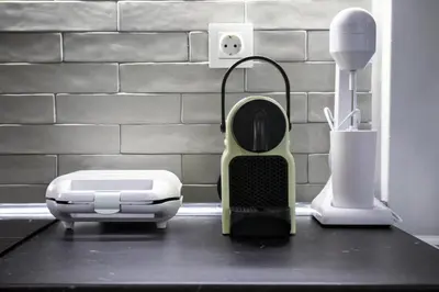 a kitchen counter with a hair dryer and a toaster at Dimosthenis_Loft1 in Athens