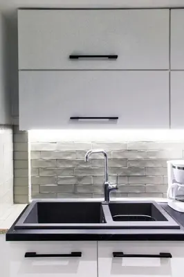 a kitchen counter with a sink in a kitchen at Dimosthenis_Loft1 in Athens