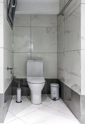 a bathroom with a toilet and two trash cans at Dimosthenis_Loft1 in Athens