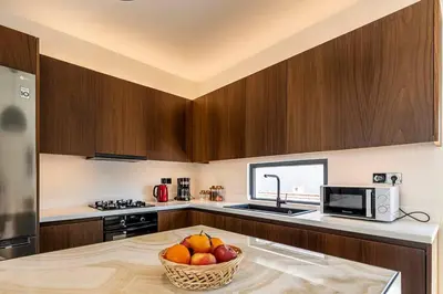 a kitchen with a bowl of fruit on a table at Stylish Contemporary Penthouse - Hip Athens Centre in Athens