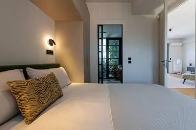 a bedroom with a bed with a zebra pillow on it at Stylish Contemporary Penthouse - Hip Athens Centre in Athens