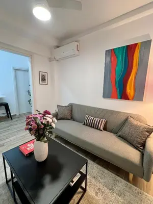 a living room with a couch and a table at Mr Negri in Athens
