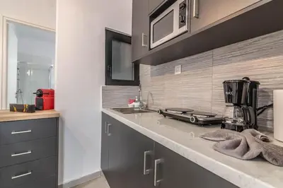 a kitchen with a counter with a blender on it at Garden of Eden in Neos Kosmos in Athens
