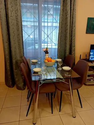 a dining room table with a bowl of fruit on it at Myilios by Ilios Company in Athens