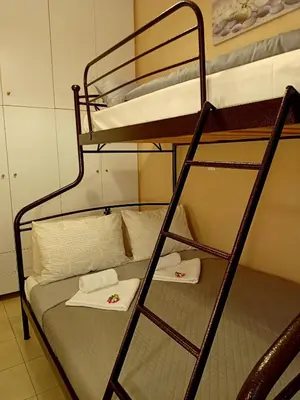 two bunk beds in a room with towels on them at Myilios by Ilios Company in Athens