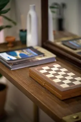 a chess board on a table with a mirror at 1BR Athenian Serenity 15 Minutes From Acropolis in Athens