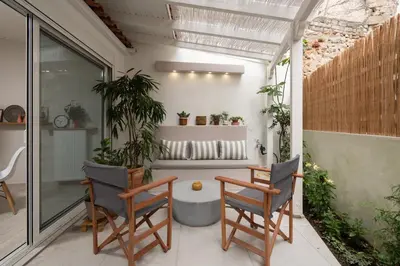 a patio with two chairs and a table at 1BR Athenian Serenity 15 Minutes From Acropolis in Athens