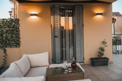 a living room with a couch and a table at Technopolis Luxury Apartments in Athens
