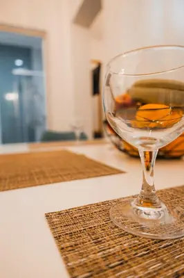 a wine glass sitting on top of a counter at Technopolis Luxury Apartments in Athens