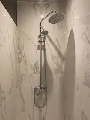 a shower with a shower head in a bathroom at Apartment in Fancy Athenian Neighbourhood in Athens
