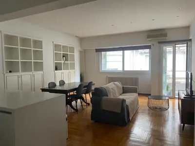 a living room with a couch and a table at Apartment in Fancy Athenian Neighbourhood in Athens