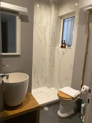 a bathroom with a tub and a toilet and a shower at Apartment in Fancy Athenian Neighbourhood in Athens