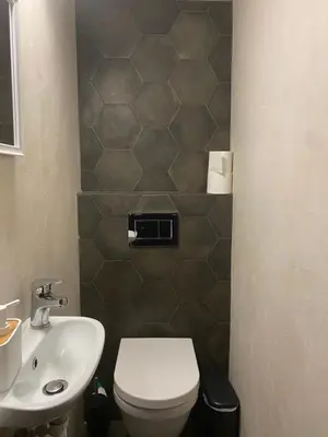 a bathroom with a toilet and a sink at Apartment in Fancy Athenian Neighbourhood in Athens