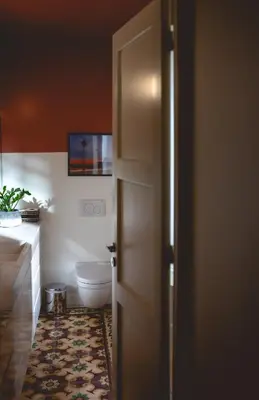 an open door to a bathroom with a toilet at Bugan-Villa in Athens