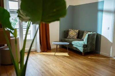 a living room with a couch and a table at Bugan-Villa in Athens