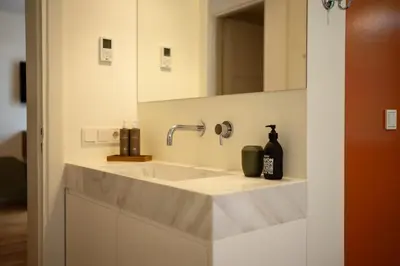 a bathroom with a sink and a mirror at Bugan-Villa in Athens