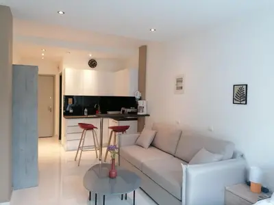 a living room with a couch and a table at Syntagma Nest Apartment in Athens