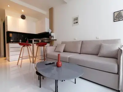 a living room with a couch and a table at Syntagma Nest Apartment in Athens