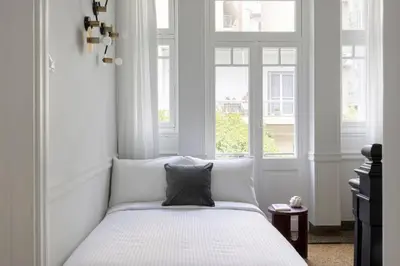 a bedroom with a bed with a pillow on it at Acropolis Villa 3BR 9ppl 10 minutes Metro&Museum in Athens