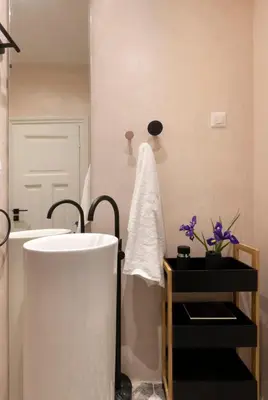 a bathroom with a white tub and a sink at Acropolis Villa 3BR 9ppl 10 minutes Metro&Museum in Athens