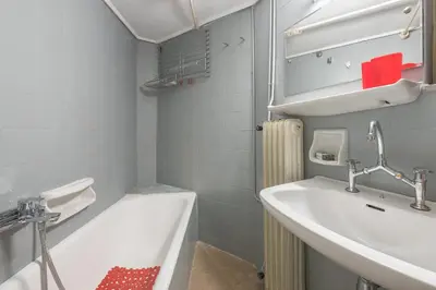 a bathroom with a sink and a bath tub at Glyfada Central Walk to Shops, Near Beach in Athens